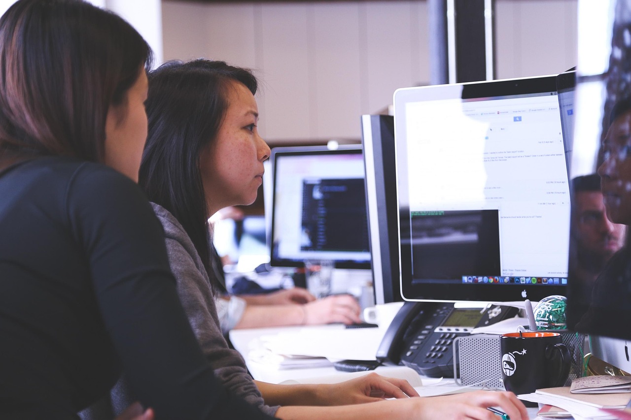 A team working at computer workstations in an office